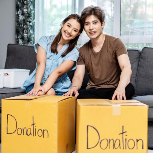 happy-young-couple-packing-stuff-clothes-object-charity-cardboard-box-reused-donate_665346-86902-Copy.jpg